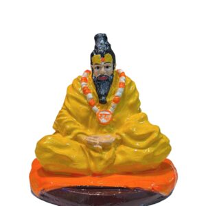 Spiritual Premanand Ji Maharaj idol embellished with flowers