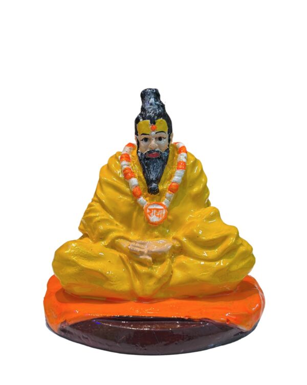 Spiritual Premanand Ji Maharaj idol embellished with flowers